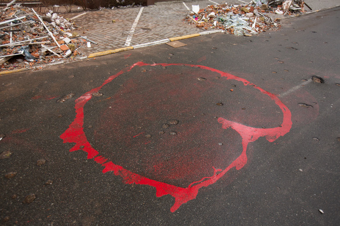 Irpin, Ukraine During the Russian Invasion Shrapnel damage on a street from a mortar round